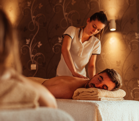 A delightful back massage with hands from a lady on a massage table
